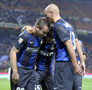 Cassano celebrates with teammates after a goal