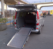 Minivan with ramp for wheelchair confined people