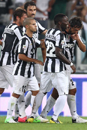 Pirlo celebrates with teammates after a goal