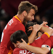 De Rossi Cassano celebrates with teammates after a goal