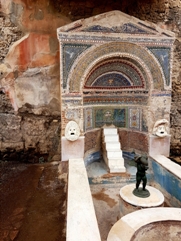 The bronze statue of a putto with a dolphin  in the House of the Large Fountain