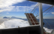 Wheelchair ramp of the ferry when You go to Capri and the same island in the background